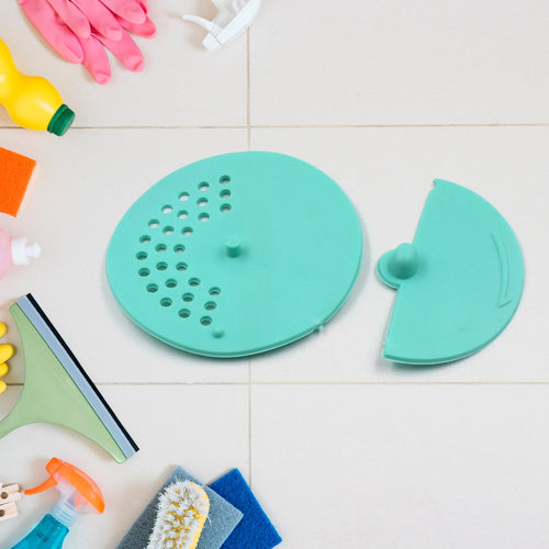 Round rubber anti-odor drain cover in a bathroom shower, preventing hair and debris.