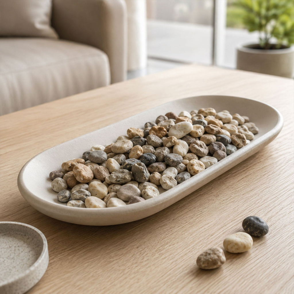 Decorative river pebbles in a vase and garden setting